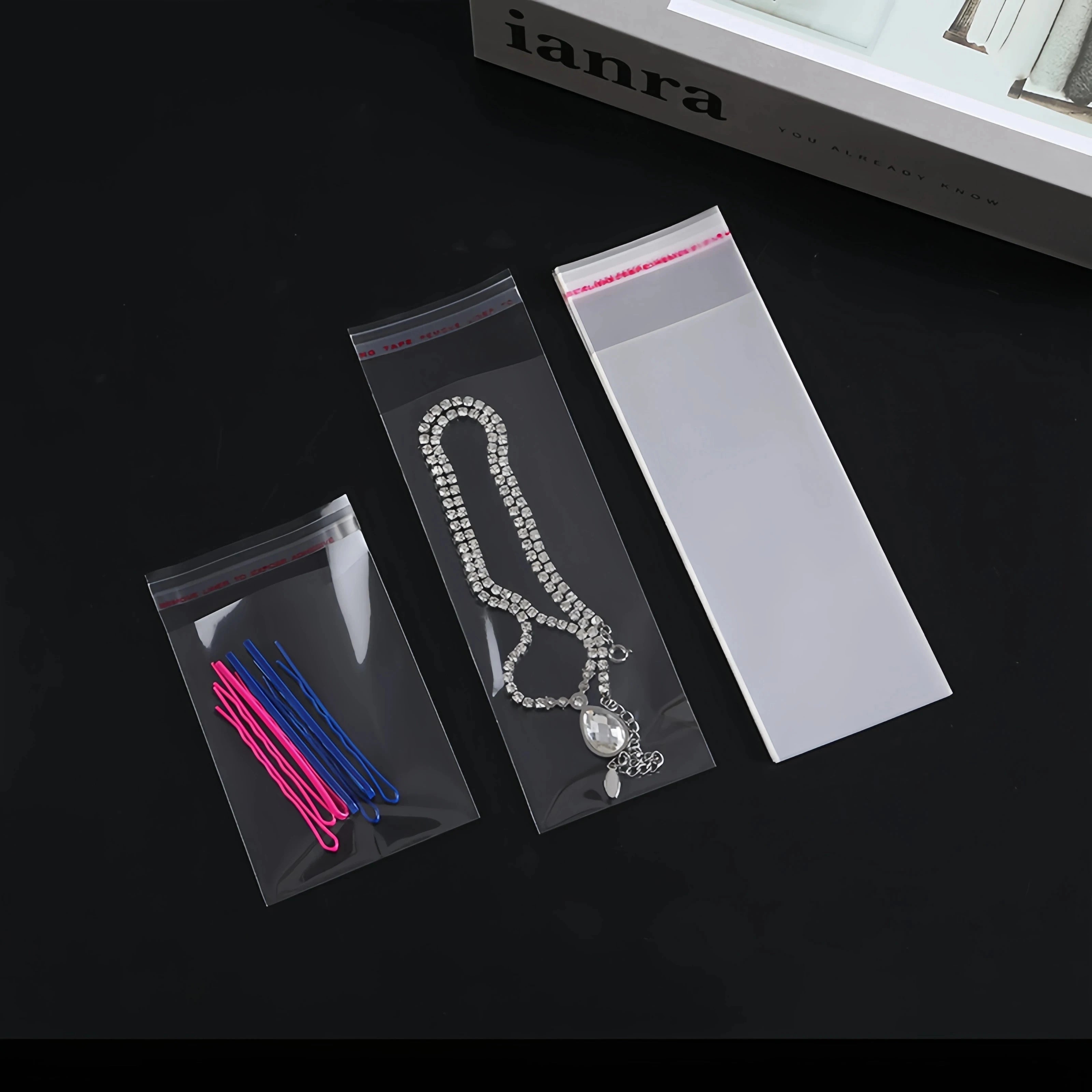 100pcs Opp Self Adhesive Bag Long Transparent Packaging Bags Universal Dust Water Proof Wrapping Material 99 in 1